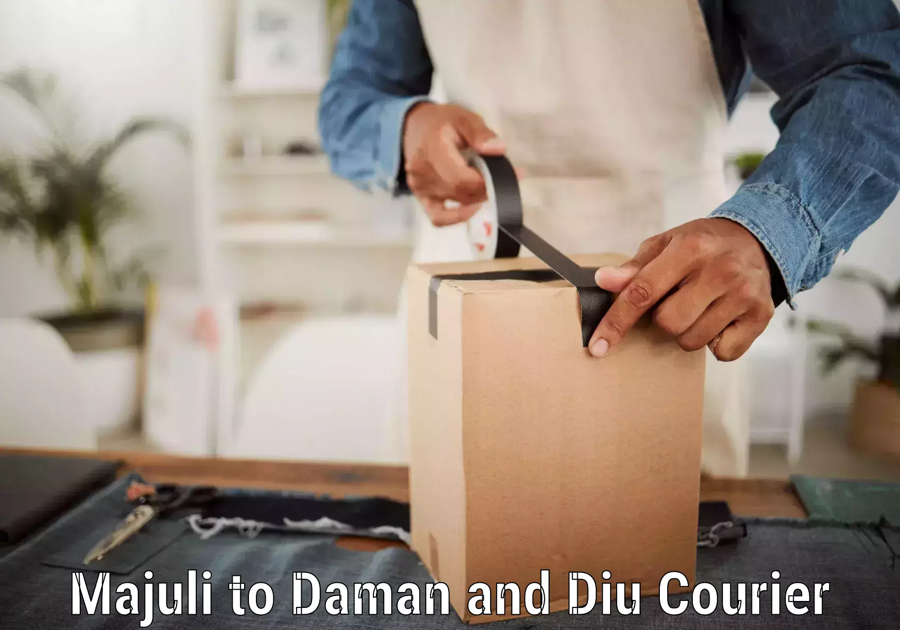 Reliable package handling in Majuli to Daman